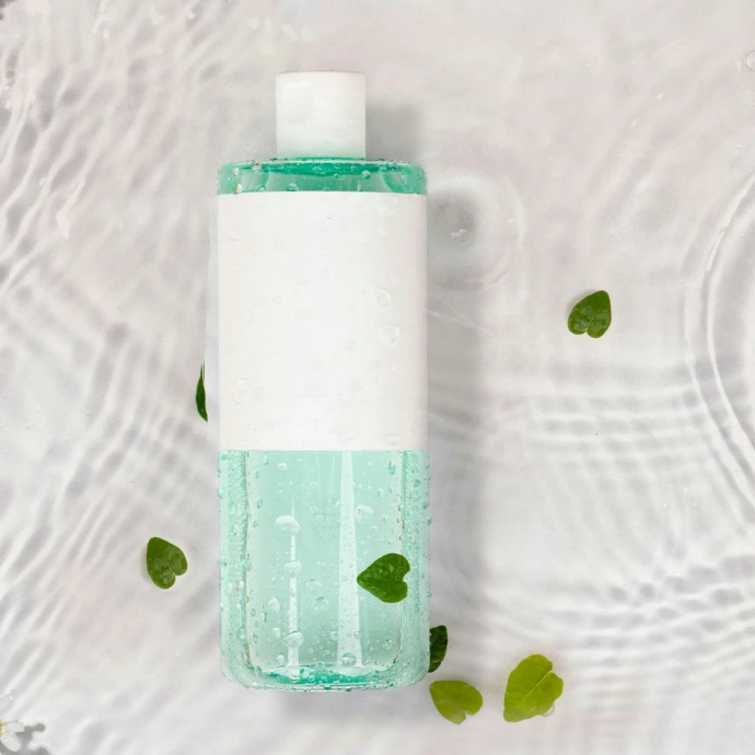 A bottle of soap sitting on top of a table